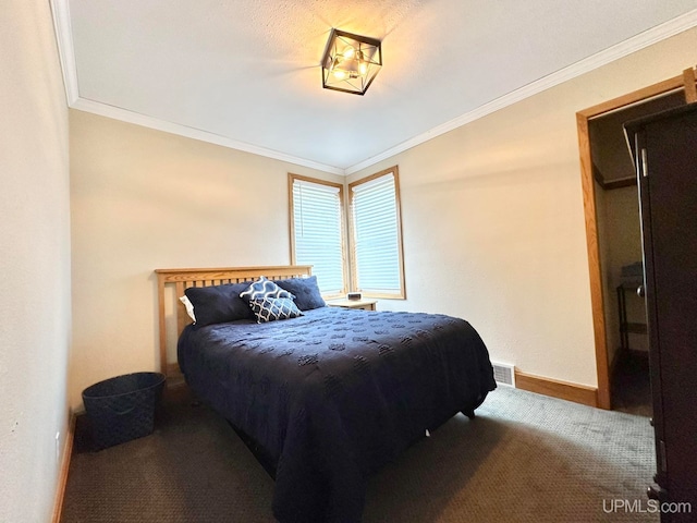 carpeted bedroom featuring crown molding