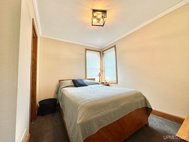 carpeted bedroom featuring ornamental molding and a textured ceiling