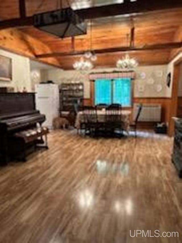 miscellaneous room featuring hardwood / wood-style floors and beam ceiling