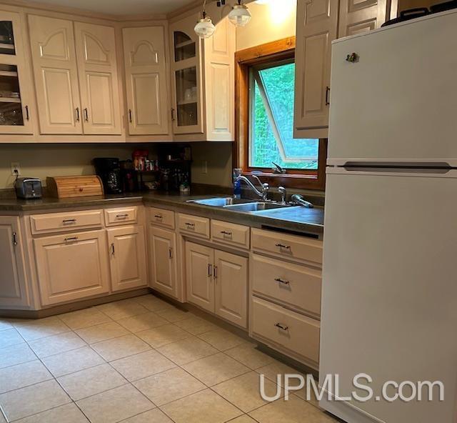 kitchen with white range with gas cooktop and light tile patterned flooring