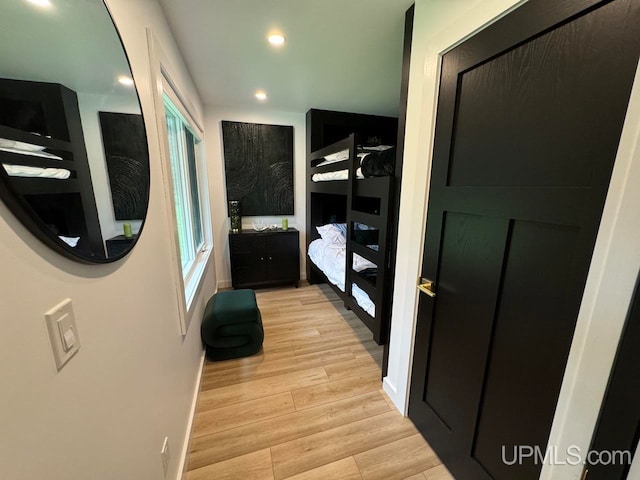 hallway with light hardwood / wood-style flooring