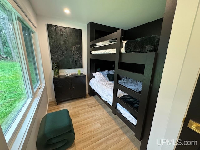 bedroom with light wood-type flooring