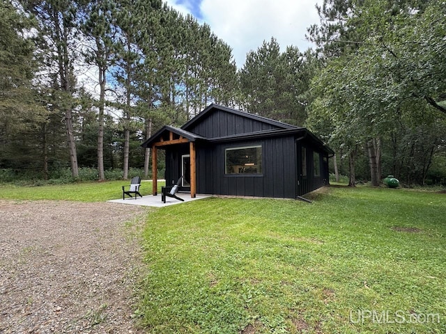 exterior space featuring a front yard and a patio area