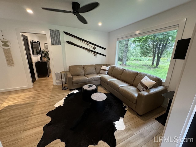 living area featuring a ceiling fan, visible vents, recessed lighting, and light wood-type flooring
