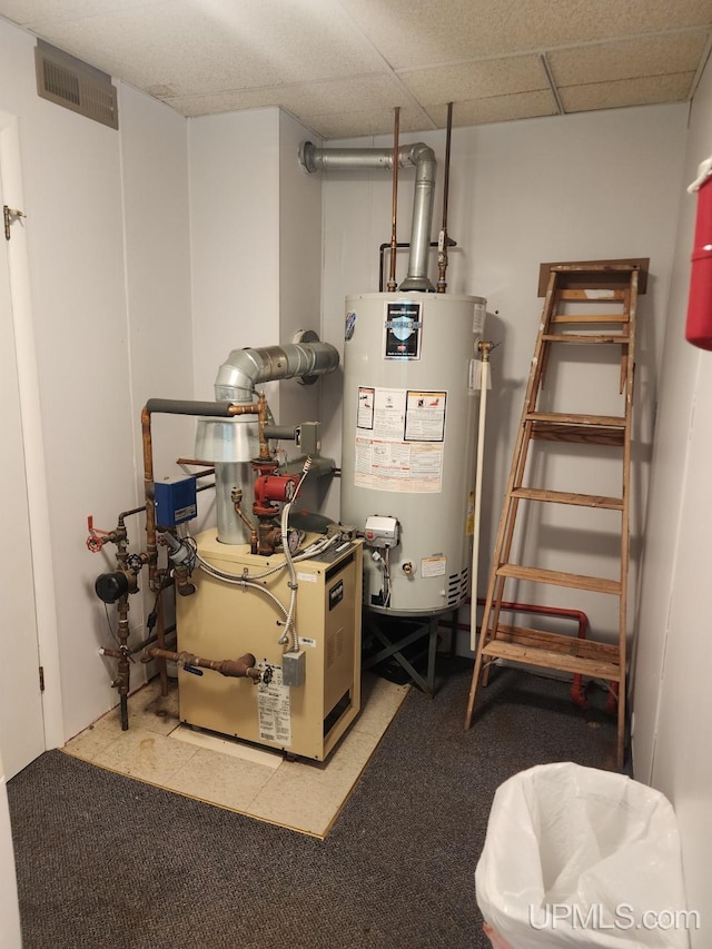 utility room featuring water heater