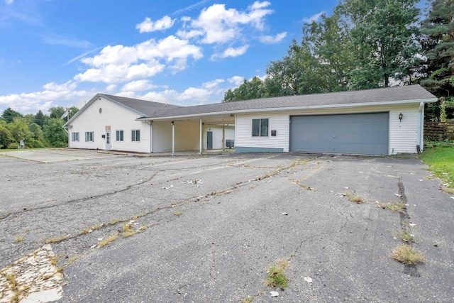 single story home with a garage