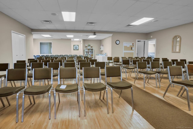 misc room featuring light hardwood / wood-style flooring and a paneled ceiling