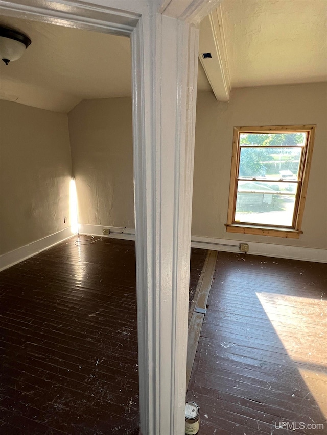 empty room featuring dark hardwood / wood-style floors