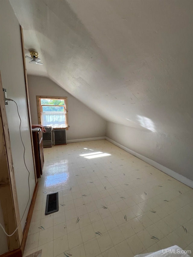 additional living space with lofted ceiling