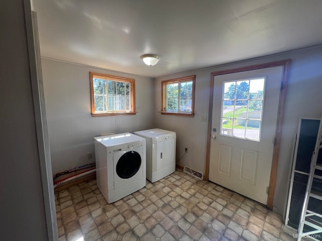 laundry room featuring washing machine and dryer