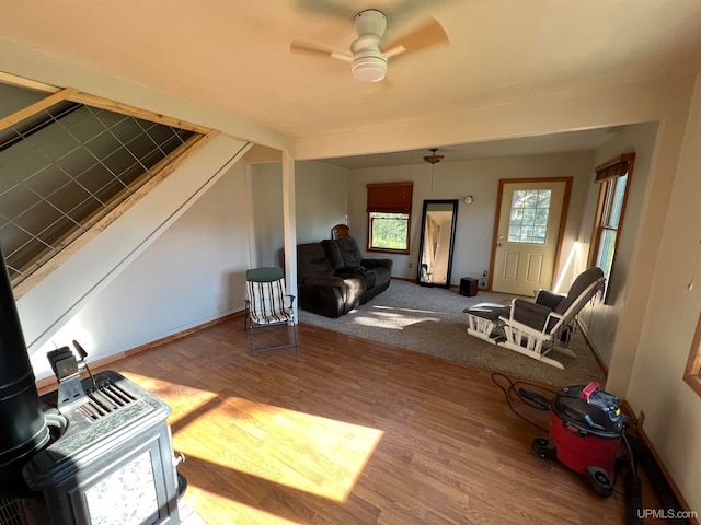 living room with ceiling fan and hardwood / wood-style floors