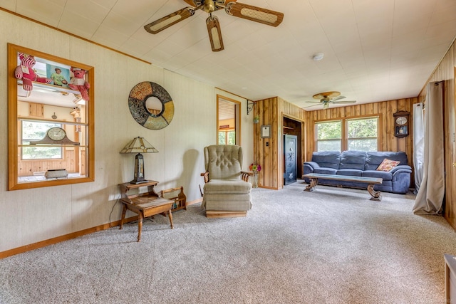 living room featuring carpet flooring and ceiling fan