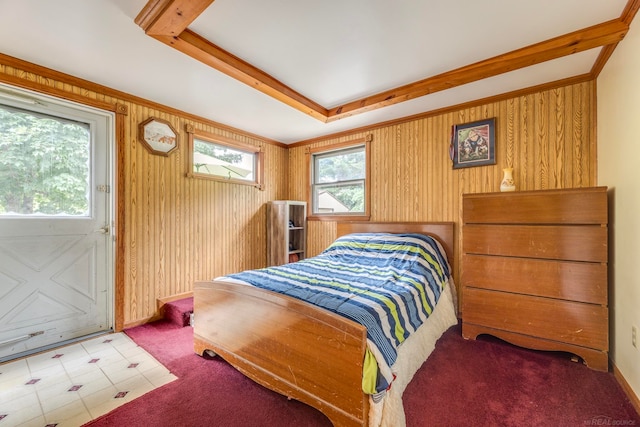 bedroom featuring wood walls and crown molding