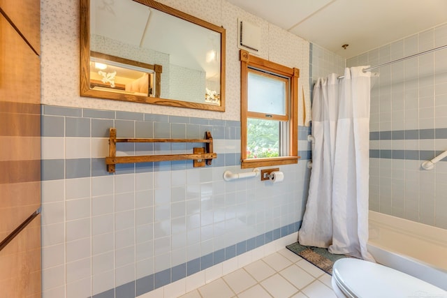 bathroom featuring tile walls, toilet, shower / bathtub combination with curtain, and tile patterned floors