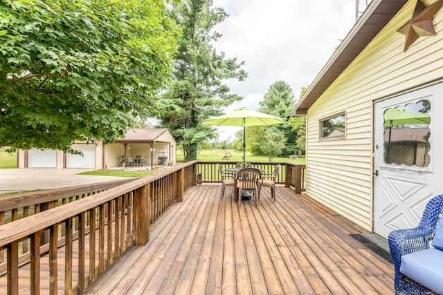 wooden deck with a garage