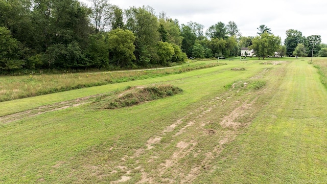 view of yard with a rural view