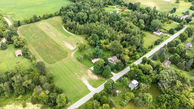 birds eye view of property with a rural view