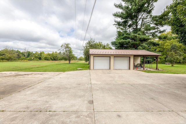 garage featuring a lawn