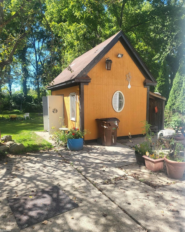 view of side of property with a patio