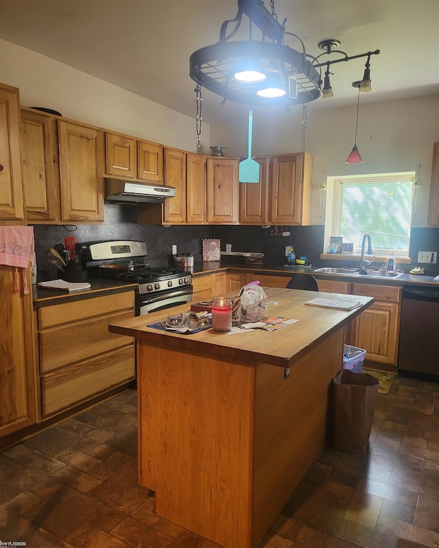 kitchen with sink, a kitchen island, decorative backsplash, appliances with stainless steel finishes, and butcher block countertops