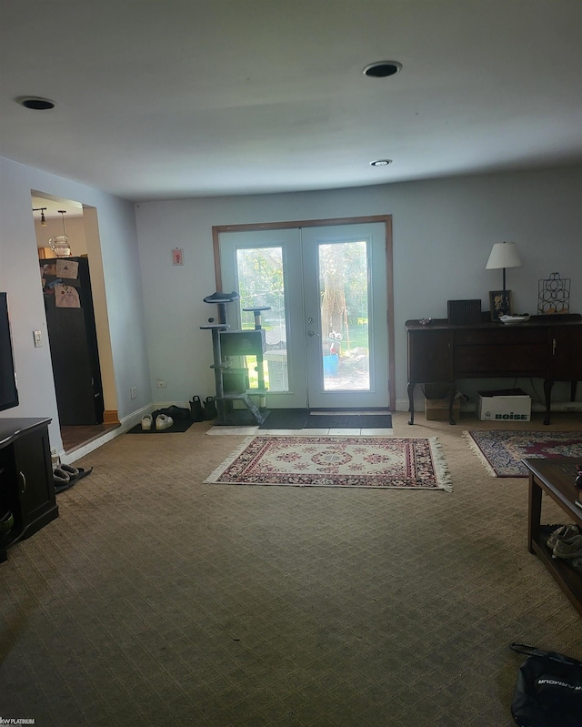 carpeted living room with french doors