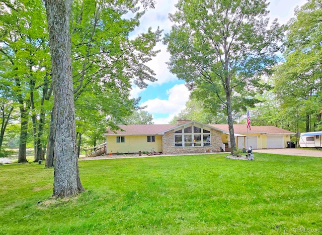 ranch-style house with a front yard and a garage