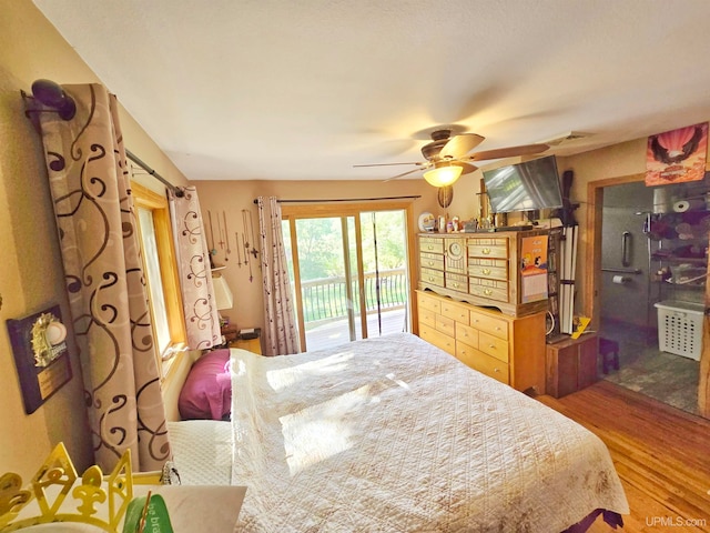 bedroom featuring ceiling fan, wood-type flooring, and access to outside