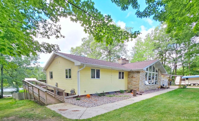 exterior space with a yard and a carport