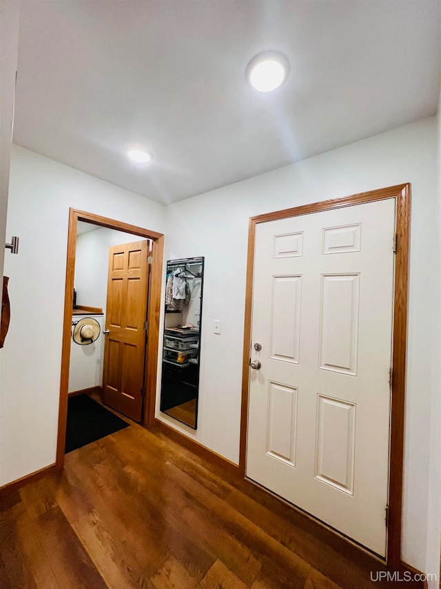 entryway featuring washer / clothes dryer and dark hardwood / wood-style floors