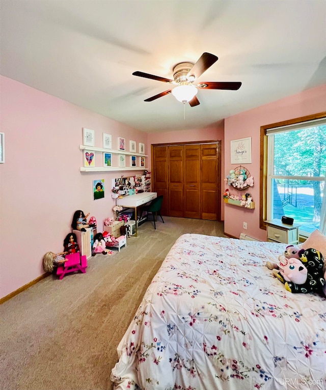 carpeted bedroom with ceiling fan