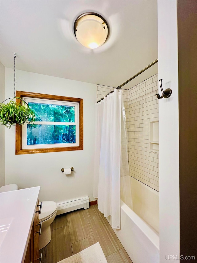 full bathroom featuring a baseboard heating unit, vanity, toilet, and shower / bath combo with shower curtain