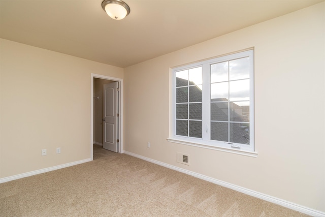 view of carpeted spare room