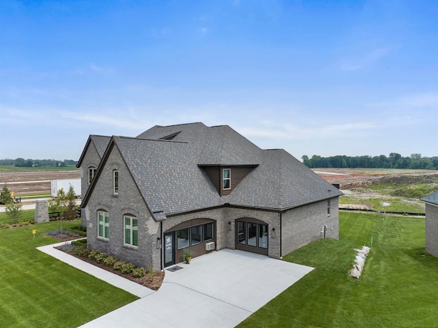 french country style house featuring a front lawn and a rural view