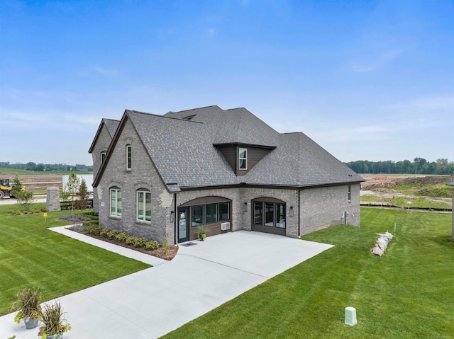 view of front of home featuring a rural view and a front lawn