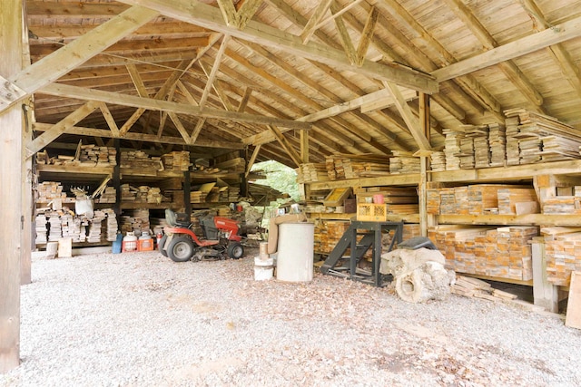 miscellaneous room with wooden ceiling, lofted ceiling with beams, and carpet floors