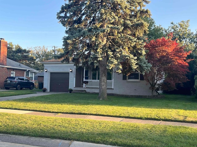 view of property hidden behind natural elements featuring a front lawn, a garage, and a porch