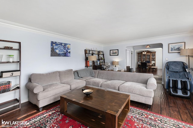 living room with dark hardwood / wood-style floors and ornamental molding