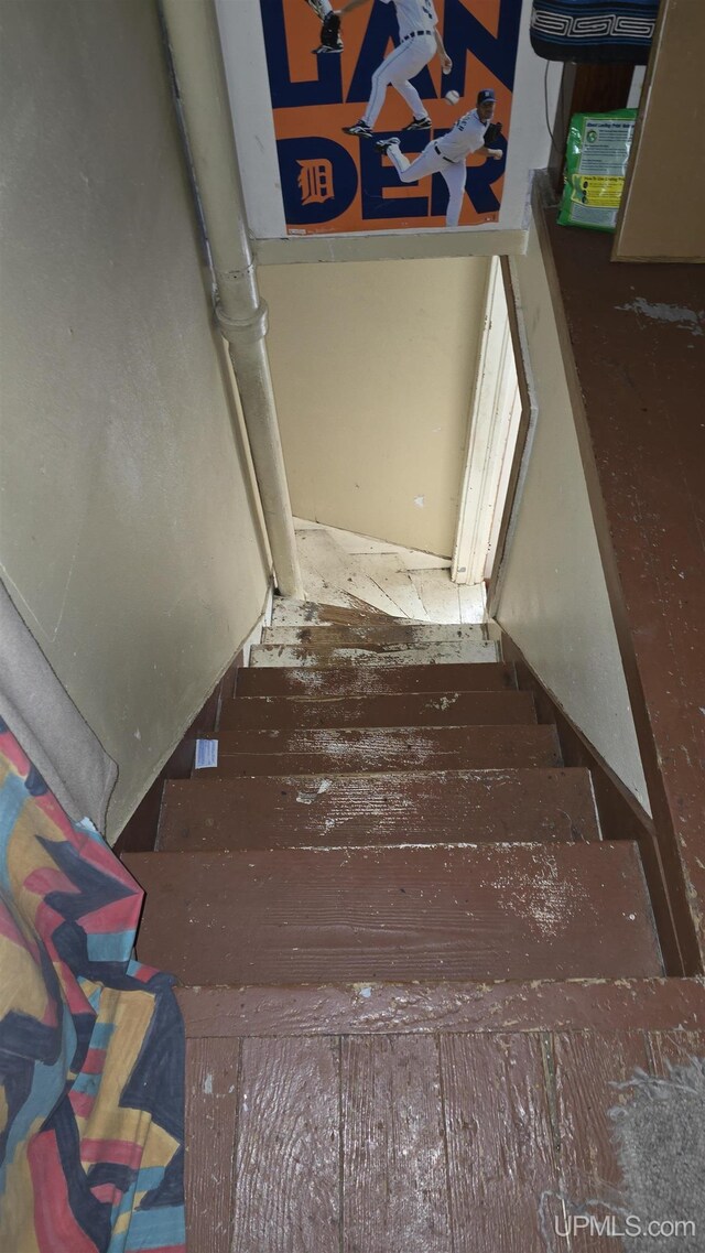 staircase featuring hardwood / wood-style flooring