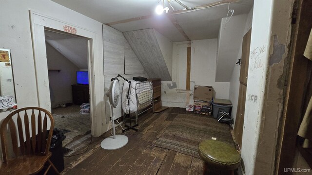 interior space with dark wood-type flooring and lofted ceiling