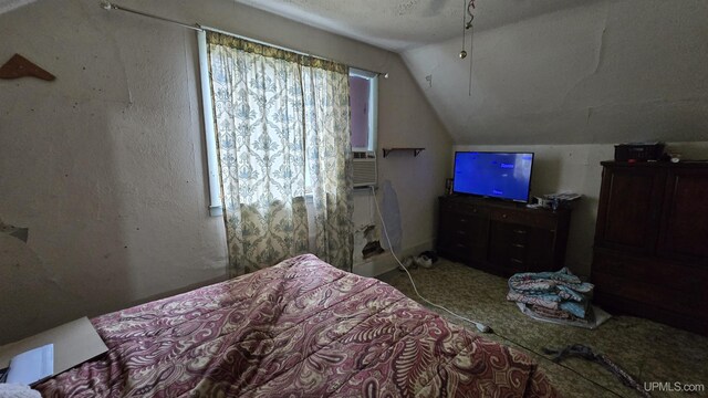 carpeted bedroom with vaulted ceiling