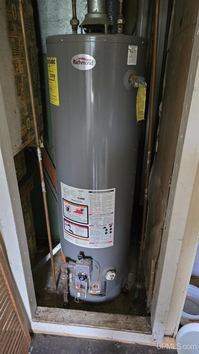 utility room with gas water heater