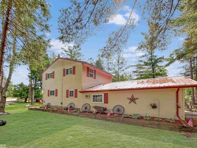 view of property exterior with a yard