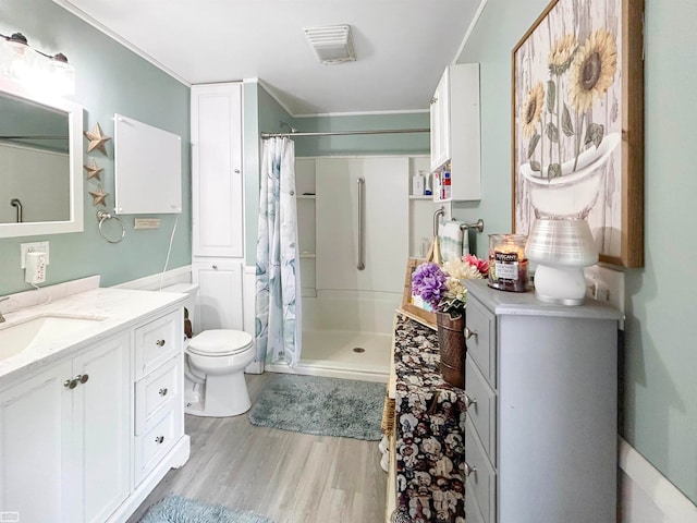 bathroom with a shower with shower curtain, toilet, vanity, and wood-type flooring