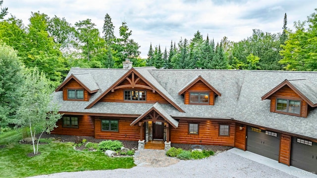 log cabin featuring a garage