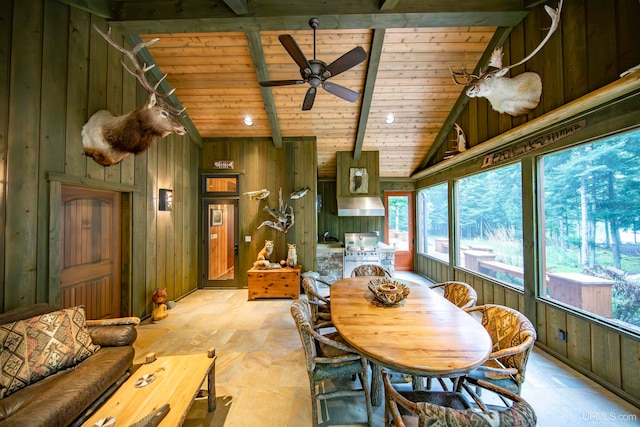 dining space featuring vaulted ceiling, a wealth of natural light, and wood ceiling