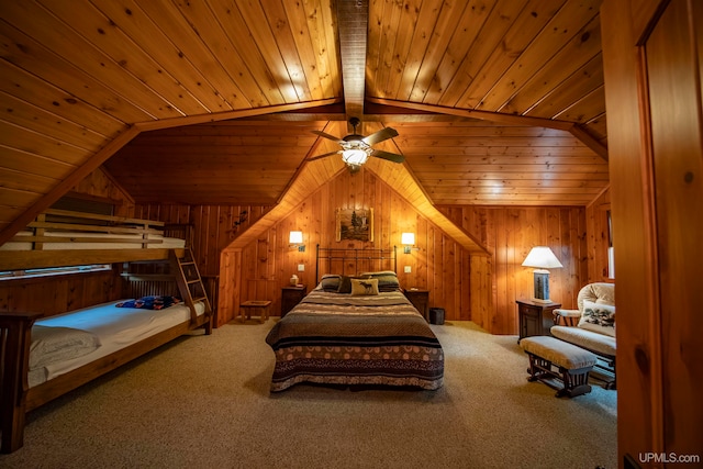 bedroom featuring lofted ceiling, wood walls, carpet floors, and wood ceiling