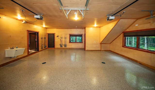 garage with sink and a garage door opener