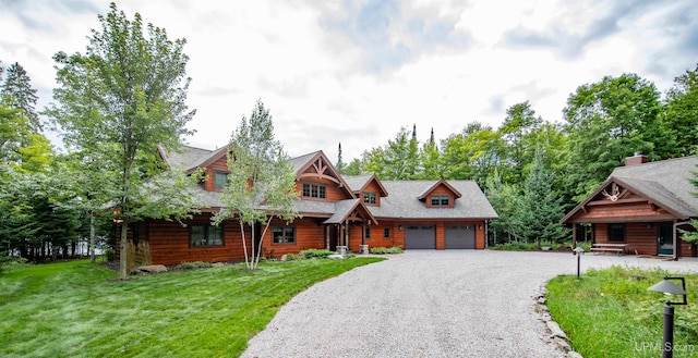 log cabin featuring a front lawn