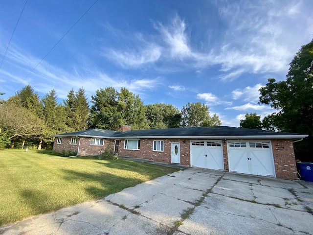 single story home with a garage and a front yard