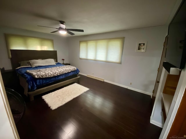 bedroom with ceiling fan and dark hardwood / wood-style flooring